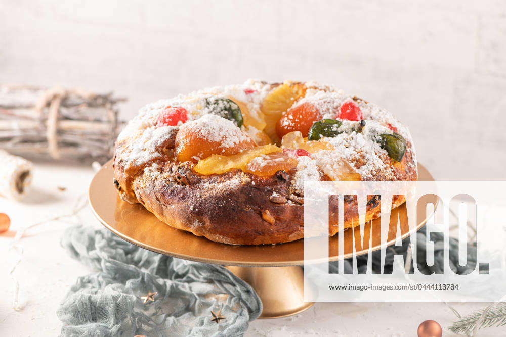 Bolo do Rei or King s Cake Bolo do Rei or King s Cake, Made for Christmas, Carnavale or Mardi Gras with Christmas season elements in Background.
