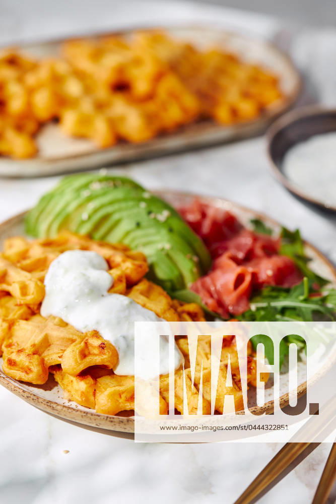Hearty sweet potato or pumpkin waffles with avocado, salmon, arugula and sauce Hearty sweet potato or pumpkin waffles with avocado, salmon, arugula and sauce