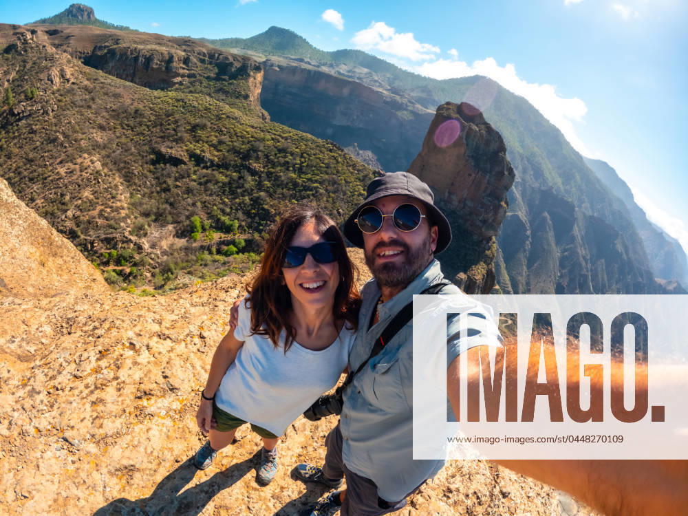 Selfie of a couple at the Roque Palmes viewpoint near Roque Nublo in Gran Canaria, Canary Islands