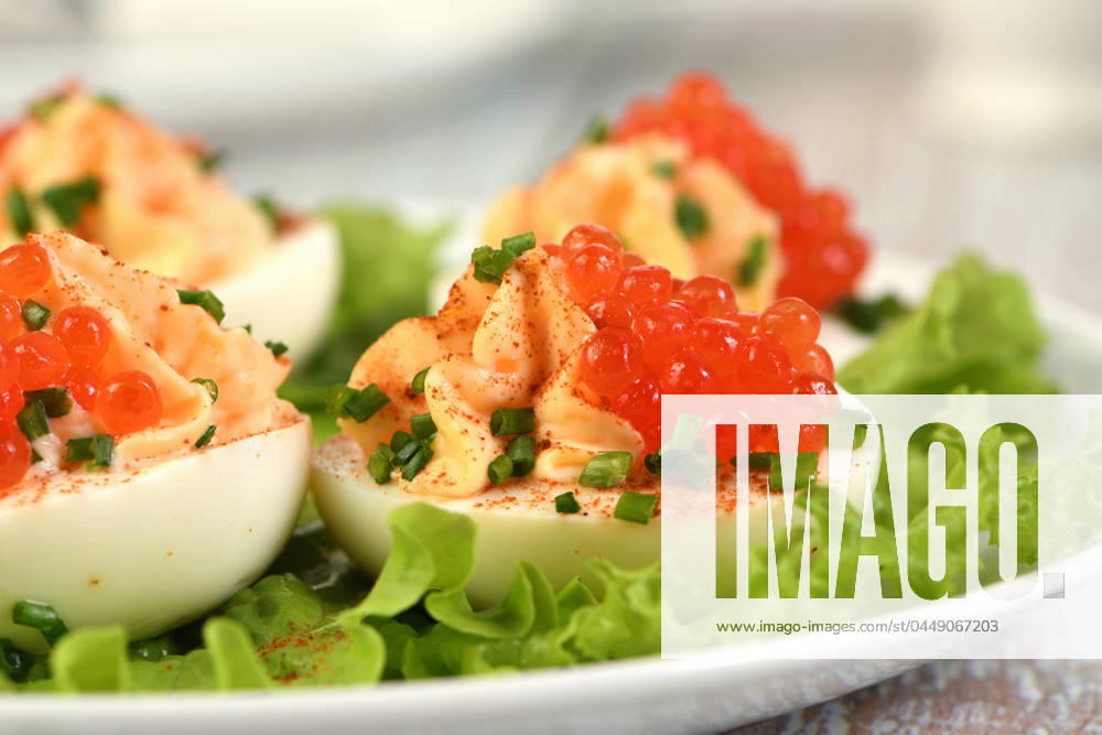 Stuffed eggs with salmon caviar Stuffed eggs with salmon caviar are a popular appetizer for any occasion. Elegantly decorated and expertly seasoned, they will always be a beautiful appetizer at a party.