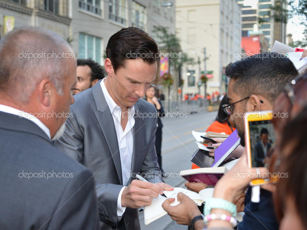 Actor Benedict Cumberbatch signs autographs at the Toronto International Film Festival for his new film 12 Years a Slave on September 6, 2013.