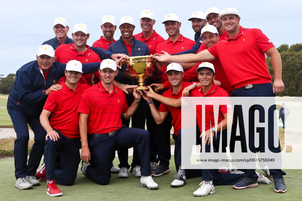 Victoria, Melbourne, Australila: (L-R top) Steve Stricker, Patrick Reed, Webb Simpson, Tiger Woods, Matt Kuchar, Gary Woodland, Dustin Johnson, Xander Schauffele, Tony Finau and Bryson DeChambeau. (L-R bottom) Fred Couples, Zach Johnson, Patrick Cantlay, Justin Thomas and Rickie Fowler with the trophy after beating the International team at the 2019 Presidents Cup at The Royal Melbourne Golf Club. Golf 2019: 2019 Presidents Cup: Final Round - ZUMAw109 20191215_zap_w109_001