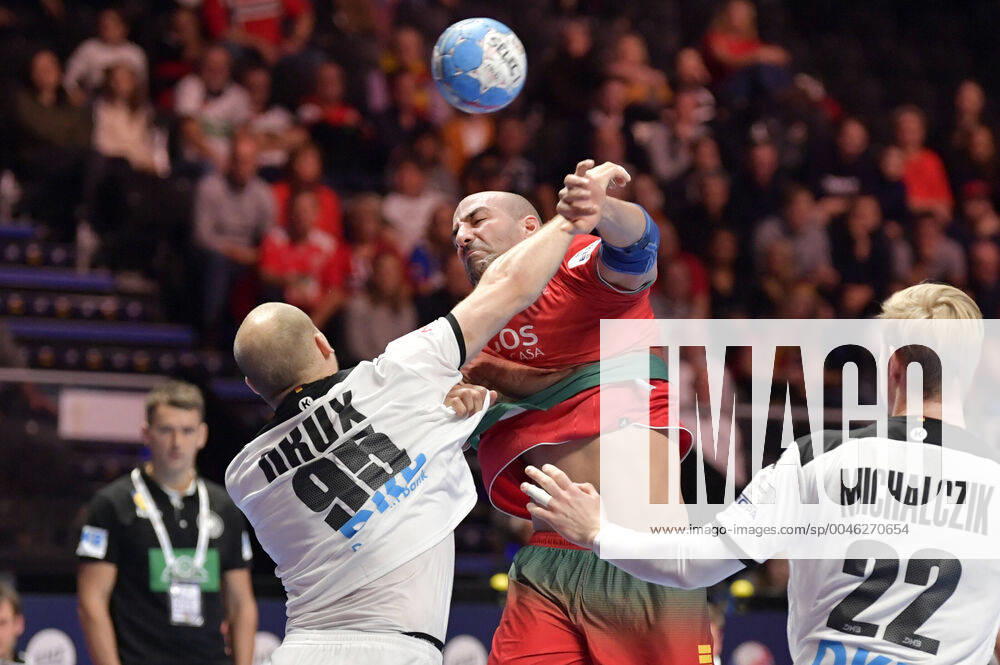 Portugal s Joao Miguel Ferraz in action againts Germany s Paul Drux and Marian Michalczik during the match for fifth sixth place between Germany and Portugal during the Men s European Handball Championship in Stockholm, Sweden, on Jan. 25, 2020. Stockholm Sverige