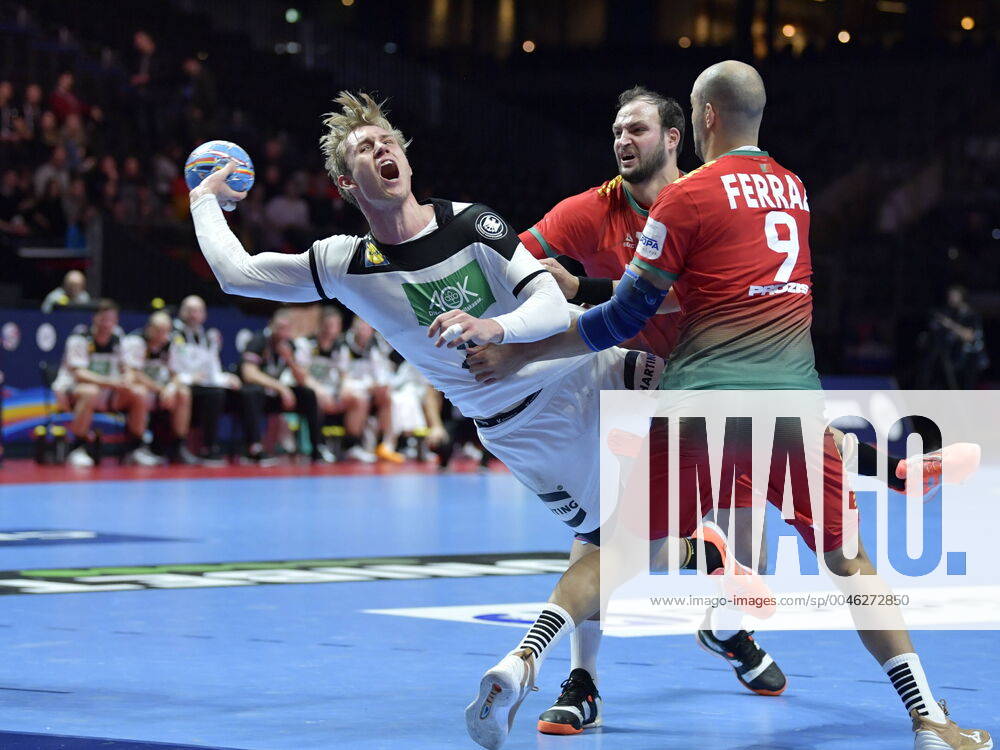 Germany s Marian Michalczik (L) scores during the last few minutes of the match for fifth sixth place between Germany and Portugal during the Men s European Handball Championship in Stockholm, Sweden, on Jan. 25, 2020. Stockholm Sverige