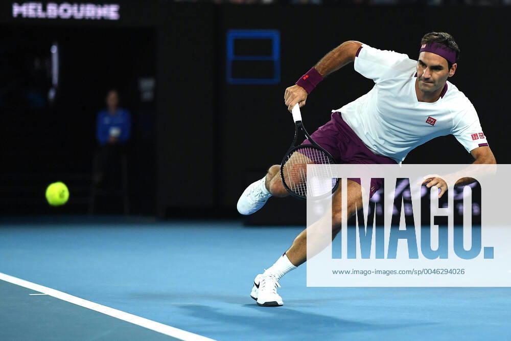 KW04 AUSTRALIAN OPEN DAY 7, Roger Federer of Switzerland attempts to play a return during his fourth round match against Marton Fucsovics of Hungary on day seven of the Australian Open tennis tournament at Rod Laver Arena in Melbourne, Sunday, January 26, 2020. ( NO ARCHIVING, , NO USE IN BOOKS WITHOUT CONSENT MELBOURNE VIC AUSTRALIA