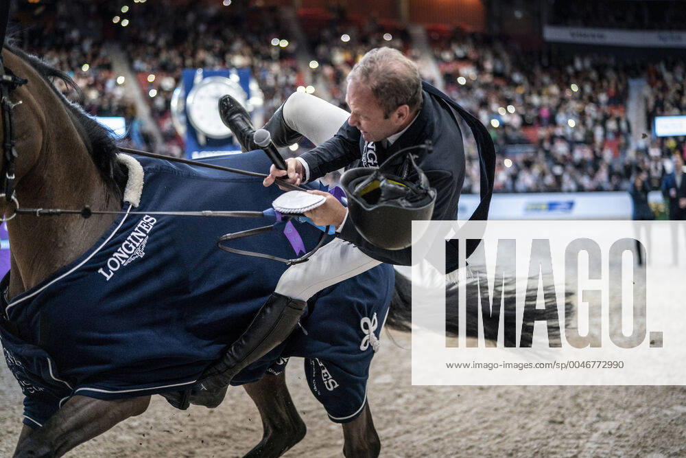 KW08 Geir Gulliksen of Norway falls of his horse Groep Quatro when he rides a ? lap of honor? after winning the FEI Jumping World Cup competition during Gothenburg Horse Show at Scandinavium in Gothenburg, Sweden February 23, 202. GOTHENBURG Sweden