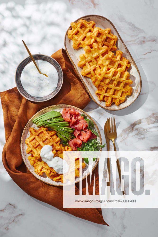 Hearty sweet potato or pumpkin waffles with avocado, salmon, arugula and sauce Hearty sweet potato or pumpkin waffles with avocado, salmon, arugula and sauce