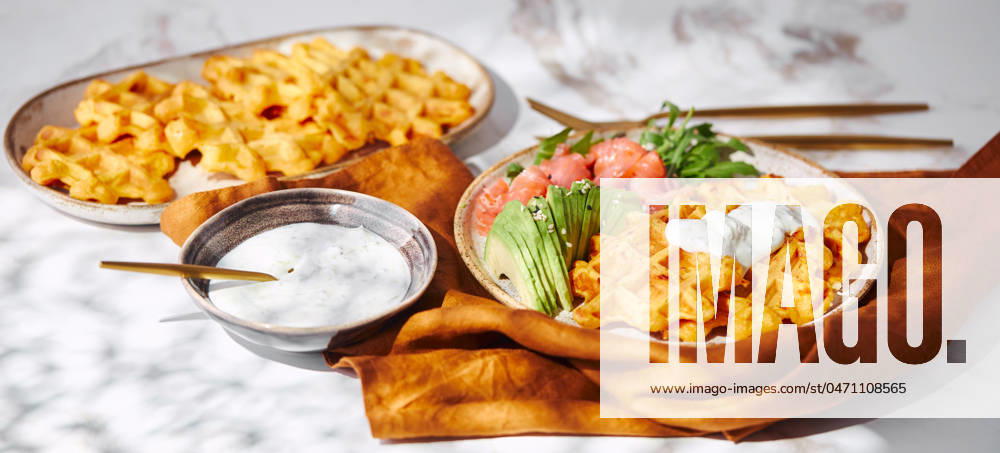 Hearty sweet potato or pumpkin waffles with avocado, salmon, arugula and sauce Hearty sweet potato or pumpkin waffles with avocado, salmon, arugula and sauce