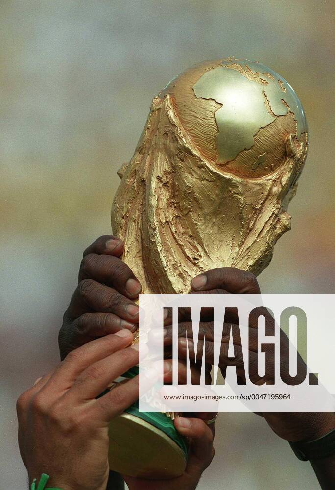 Inpho Photo Packages - Imagery Of Hands Through The Years 17 4 2020 1994 World Cup Final, Rose Bowl, Pasadena, California, USA Brazil vs Italy Brazilian hands on the FIFA World Cup, WM, Weltmeisterschaft, Fussball Trophy after beating Italy on penalties Brazilian hands on the FIFA World Cup Trophy 17 4 2020