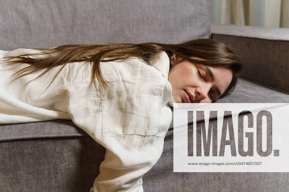 Young beautiful business woman after work lies on the couch, sleeps, rests Young beautiful business woman after work lies on the couch, sleeps, rests.