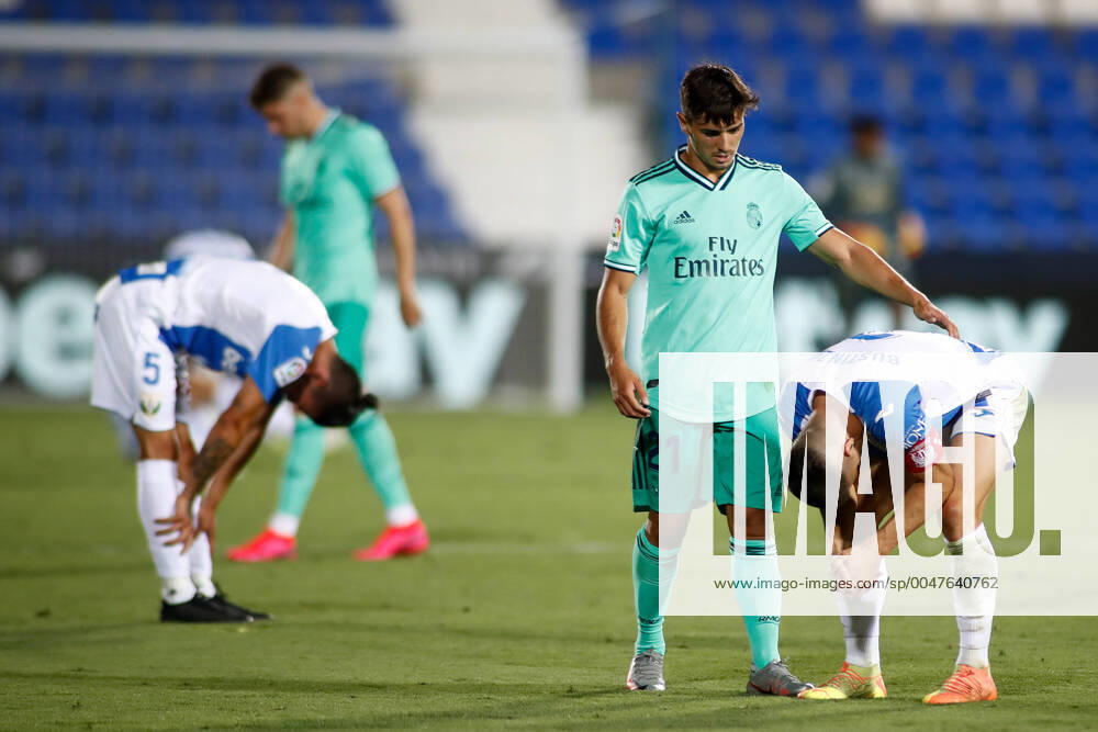 Brahim Diaz of Real Madrid helps to Unai Bustinza of Leganes during the spanish league, La Liga, football match between CD Leganes and Real Madrid at Municipal Butarque Stadium on July 19, 2020 in Valdebebas, Madrid, Spain. Leganes SPAIN - ZUMAa181 20200719_zaa_a181_181