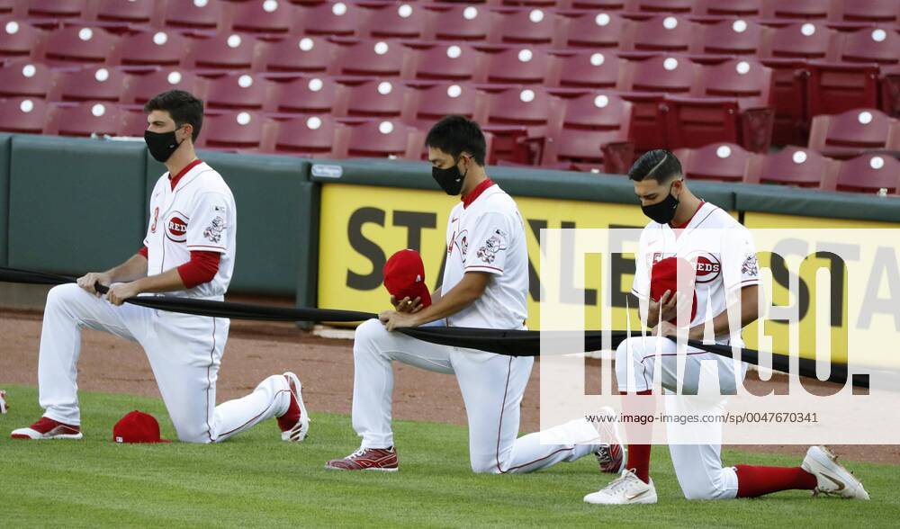 KW30 Baseball: Reds v Tigers Cincinnati Reds rookie Shogo Akiyama (C) and teammates kneel in solidarity with the Black Lives Matter movement ahead of the club s 2020 season opener against the Detroit Tigers on July 24, 2020, in Cincinnati, Ohio. Major league baseball opened the previous day about four months behind schedule due to the coronavirus pandemic.