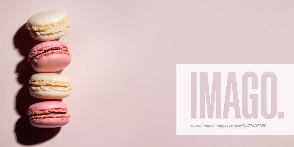 Macaroons on pink background, colorful french cookies pattern. Gift for 8 March, International Women s Day, Valentine Day Macaroons on pink background, colorful french cookies pattern. Gift for 8 March, International Women s Day, Valentine Day. Horizontal banner with copyspace