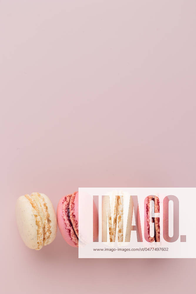 Macaroons on pink background, colorful french cookies pattern. Gift for 8 March, International Women s Day, Valentine Day Macaroons on pink background, colorful french cookies pattern. Gift for 8 March, International Women s Day, Valentine Day. Vertical banner with copyspace