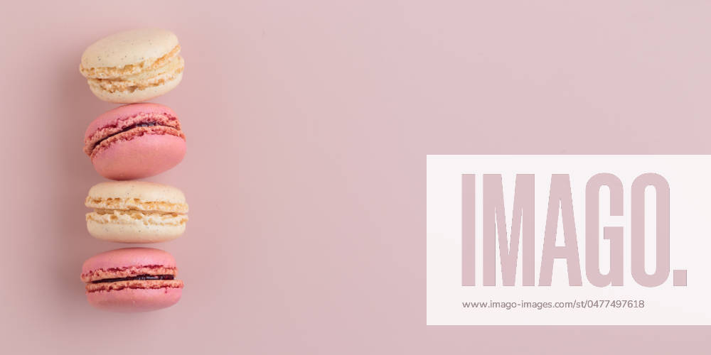 Macaroons on pink background, colorful french cookies pattern. Gift for 8 March, International Women s Day, Valentine Day Macaroons on pink background, colorful french cookies pattern. Gift for 8 March, International Women s Day, Valentine Day. Horizontal banner with copyspace