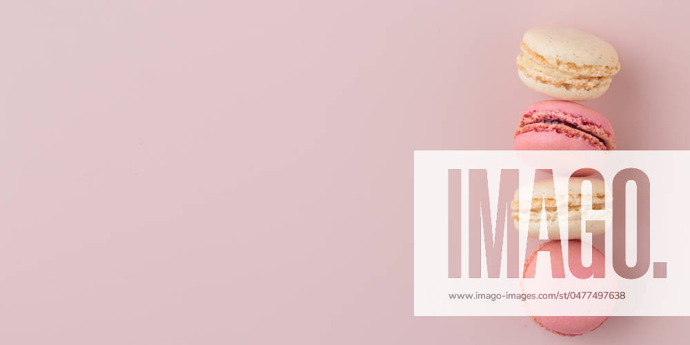 Macaroons on pink background, colorful french cookies pattern. Gift for 8 March, International Women s Day, Valentine Day Macaroons on pink background, colorful french cookies pattern. Gift for 8 March, International Women s Day, Valentine Day. Horizontal banner with copyspace