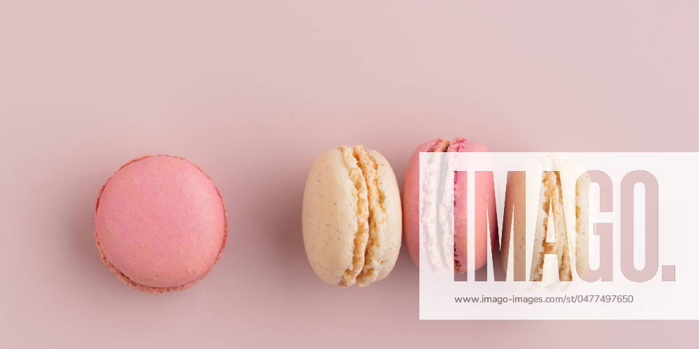 Macaroons on pink background, colorful french cookies pattern. Gift for 8 March, International Women s Day, Valentine Day Macaroons on pink background, colorful french cookies pattern. Gift for 8 March, International Women s Day, Valentine Day. Horizontal banner with copyspace