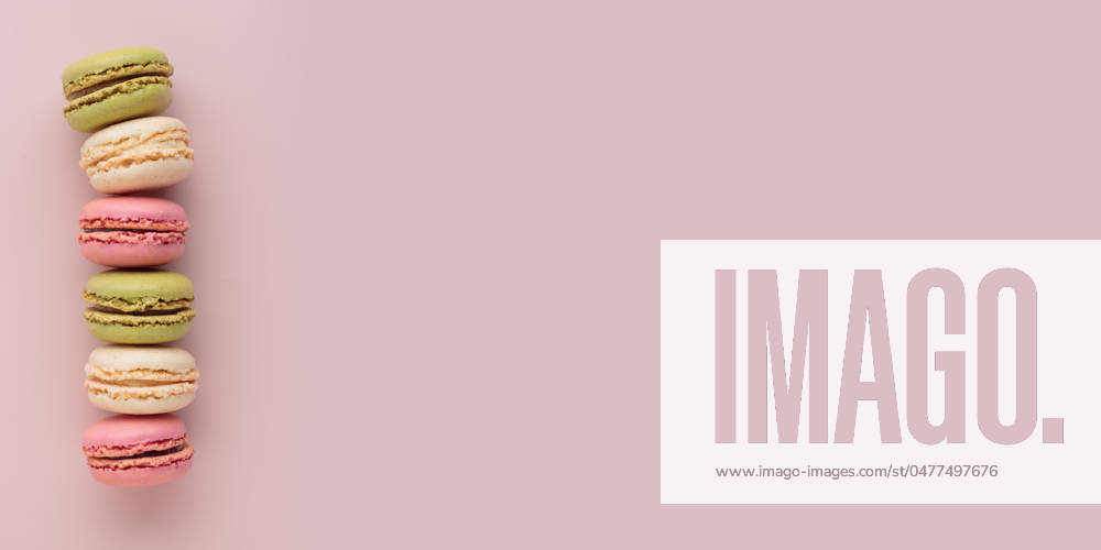 Macaroons on pink background, colorful french cookies pattern. Gift for 8 March, International Women s Day, Valentine Day Macaroons on pink background, colorful french cookies pattern. Gift for 8 March, International Women s Day, Valentine Day. Horizontal banner with copyspace