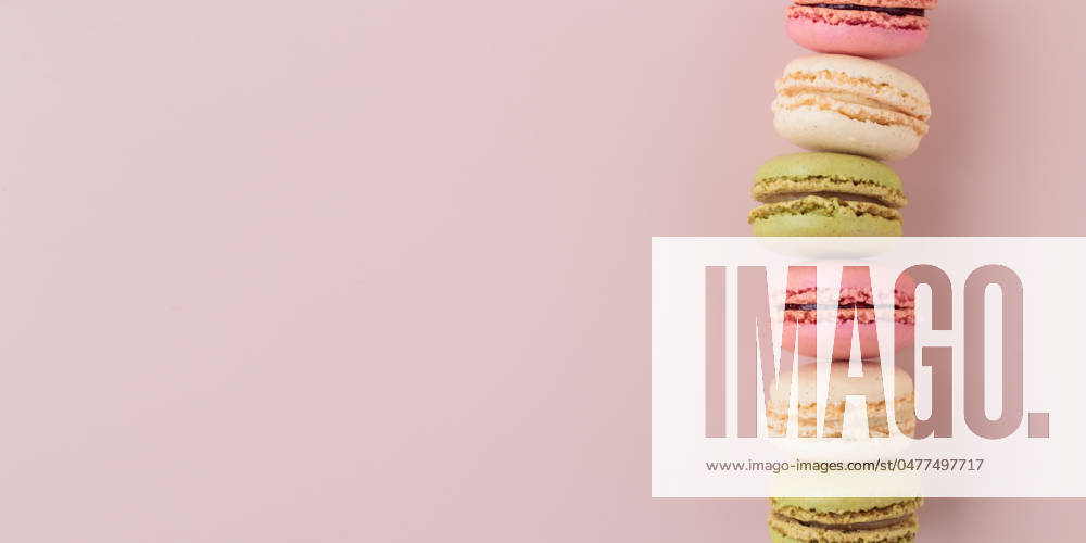 Macaroons on pink background, colorful french cookies pattern. Gift for 8 March, International Women s Day, Valentine Day Macaroons on pink background, colorful french cookies pattern. Gift for 8 March, International Women s Day, Valentine Day. Horizontal banner with copyspace