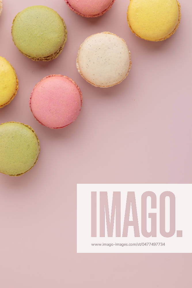Macaroons on pink background, colorful french cookies pattern. Gift for 8 March, International Women s Day, Valentine Day Macaroons on pink background, colorful french cookies pattern. Gift for 8 March, International Women s Day, Valentine Day. Vertical banner with copyspace