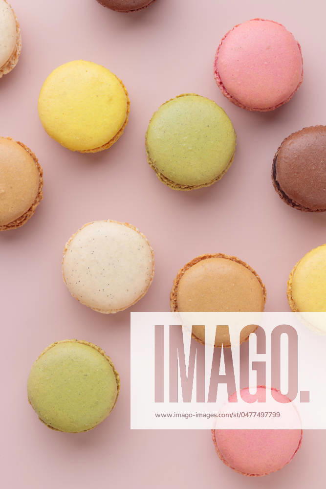 Macaroons on pink background, colorful french cookies pattern. Gift for 8 March, International Women s Day, Valentine Day Macaroons on pink background, colorful french cookies pattern. Gift for 8 March, International Women s Day, Valentine Day. Vertical