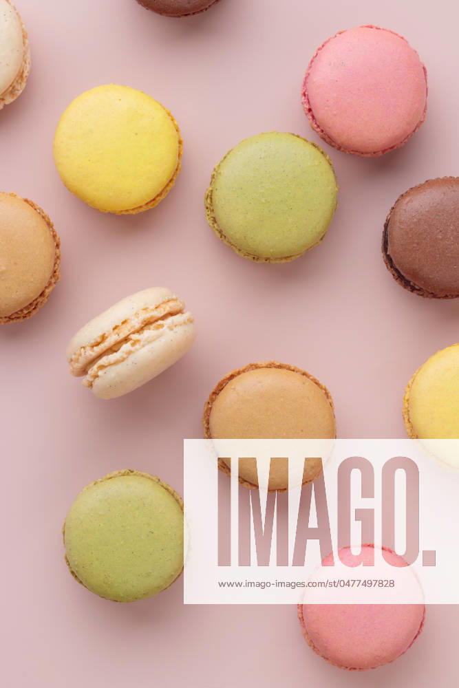 Macaroons on pink background, colorful french cookies pattern. Gift for 8 March, International Women s Day, Valentine Day Macaroons on pink background, colorful french cookies pattern. Gift for 8 March, International Women s Day, Valentine Day. Vertical