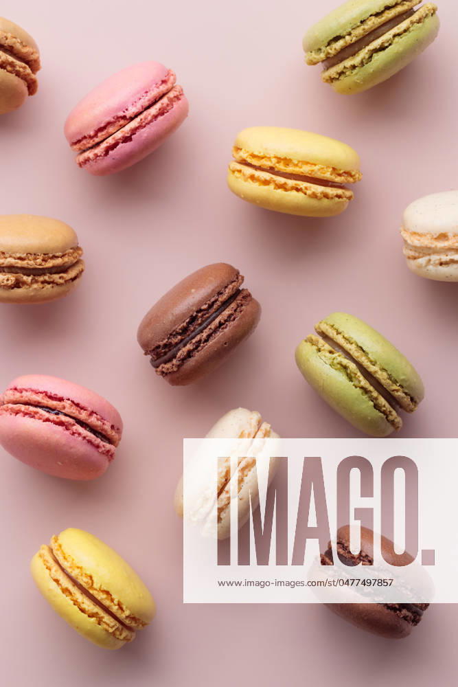 Macaroons on pink background, colorful french cookies pattern. Gift for 8 March, International Women s Day, Valentine Day Macaroons on pink background, colorful french cookies pattern. Gift for 8 March, International Women s Day, Valentine Day. Vertical