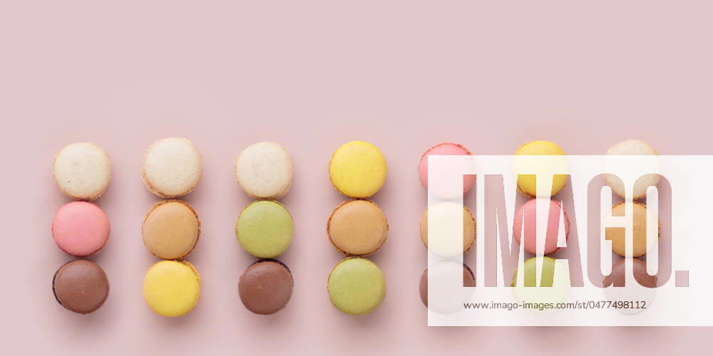 Macaroons on pink background, colorful french cookies pattern. Gift for 8 March, International Women s Day, Valentine Day Macaroons on pink background, colorful french cookies pattern. Gift for 8 March, International Women s Day, Valentine Day. Horizontal banner with copyspace