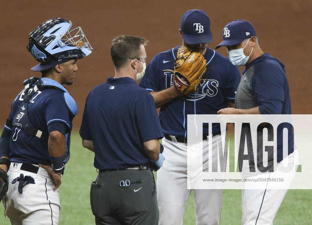 Tampa Bay Rays catcher Michael Perez (7), looks on as relief pitcher Jalen Beeks (68) is looked at by Rays medical officials and manager Kevin Cash after he appears to suffer an injury while on the mound in the ninth inning against the Baltimore Orioles at Tropicana Field, on Tuesday, Aug. 25, 2020 in St. Petersburg. Beeks had to leave the game during the ninth inning with a potentially serious arm injury. The injury to Beeks seemed concerning, similar in a way, Cash said, to what happened earlier this season to Andrew Kittredge, who tore his ulnar collateral ligament and is out for the season, and might need Tommy John surgery. St. Petersburg USA - ZUMAs70_ 0047948033st