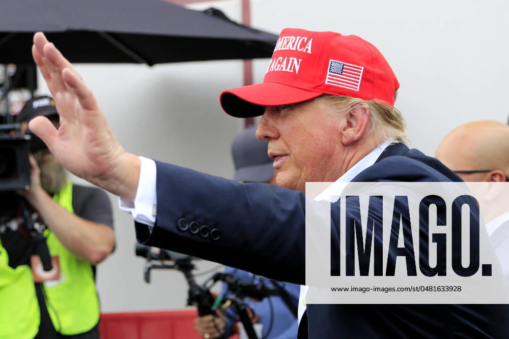 CHARLOTTE, NC - MAY 26: Former President of the United States of America Donald Trump waves to the crowd on pit road prior to the running of the NASCAR Cup Series Coca-Cola 600 on May 26, 2024 at Charlotte Motor Speedway in Charlotte, NC. (Photo by Jeff Robinson Icon Sportswire) Icon1045686866