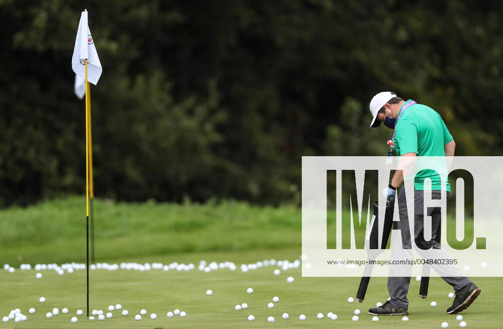 KW39 Dubai Duty Free Irish Open, Galgorm Spa & Golf Resort, Ballymena, Co. Antrim 23 9 2020 A course worker collects balls from a putting green A course worker collects balls from a putting green 23 9 2020