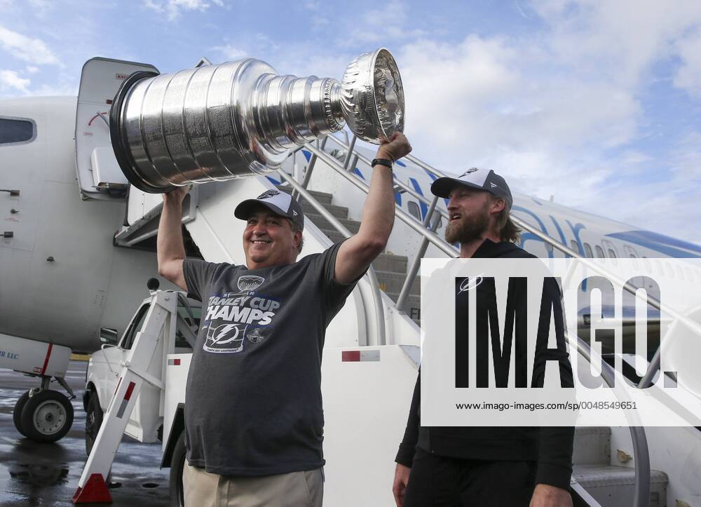 Tampa Bay Lightning owner Jeff Vinik, left, holds the Stanley Cup as team captian Steven Stamkos looks on Tuesday, Sept. 29, 2020 in Tampa. Tampa USA - ZUMAs70_ 20200929_zan_s70_040