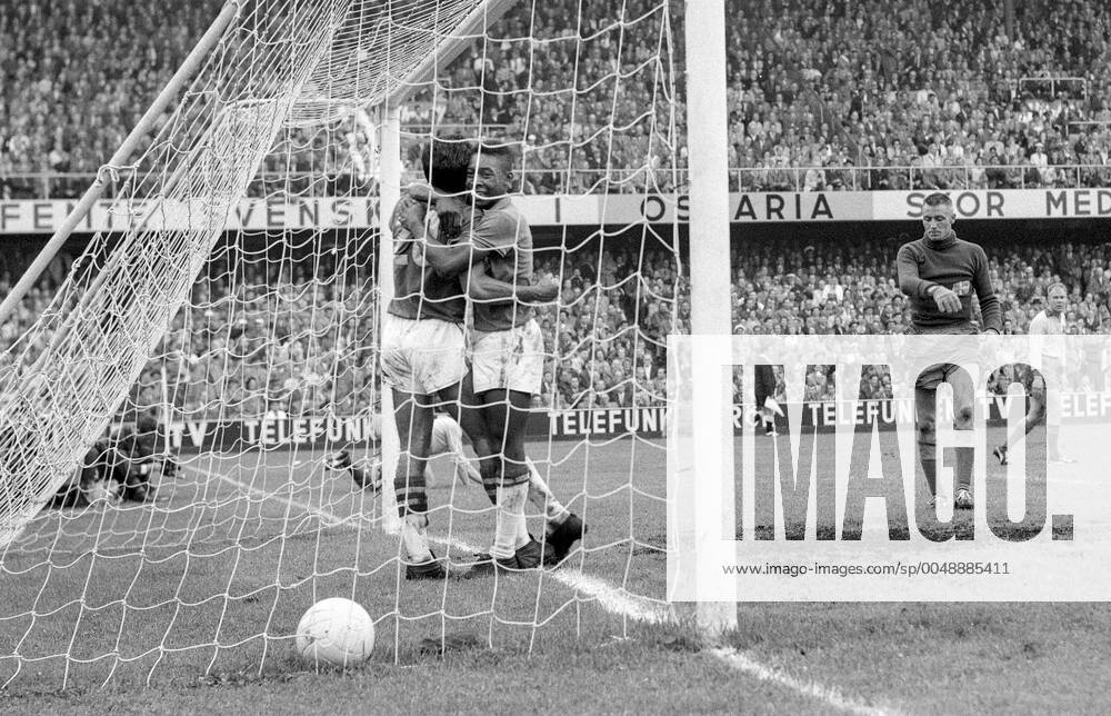 STOCKHOLM 1958-06-29 Brazils Vava (L) is hugged Pele after scoring the 2-1 goal to take the lead in the FIFA World Cup, WM, Weltmeisterschaft, Fussball final soccer match at Rasunda stadium in Stockholm, Sweden. In the background Sweden s goalkeeper Kalle Svensson and Sigge Parling. Brazil won 5-2 and became World Champions for the first time, Stockholm Sweden SOCCER
