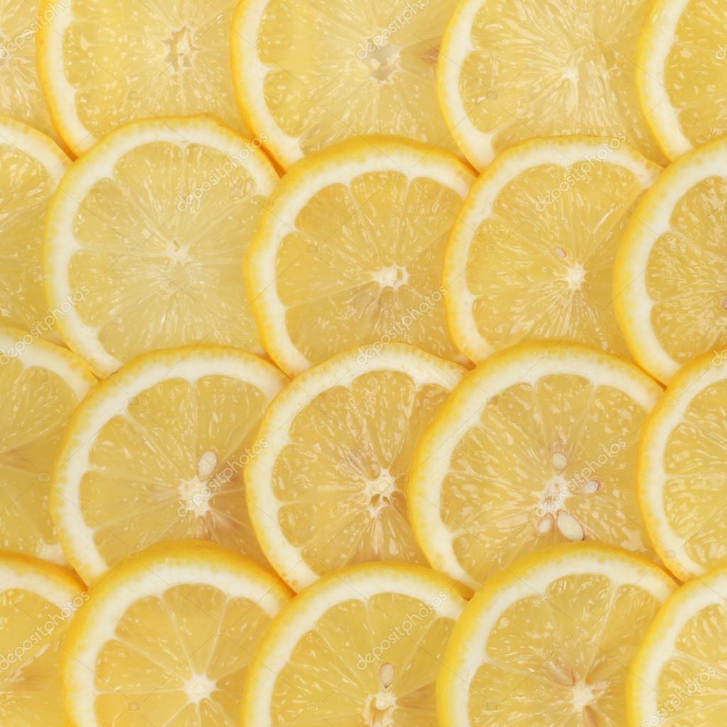 Group of sliced lemons forming a background