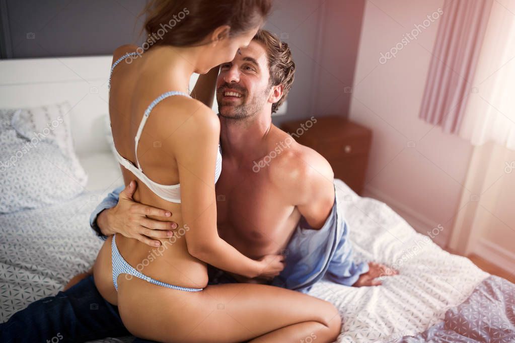 Playful sexy couple in love affectionate in the morning model released