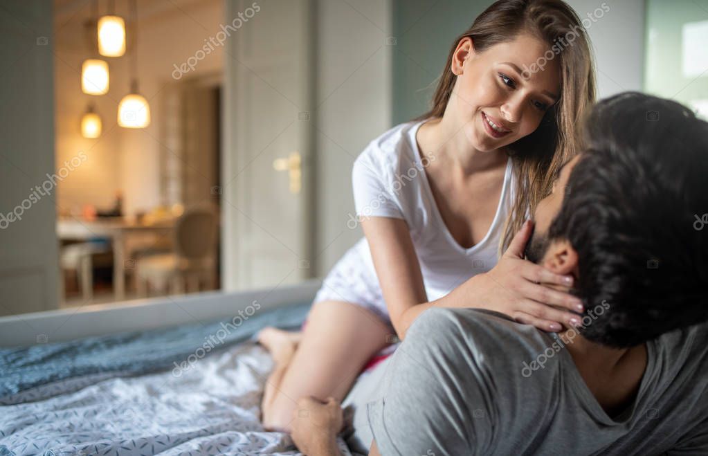 Playful sexy couple in love affectionate in the morning model released
