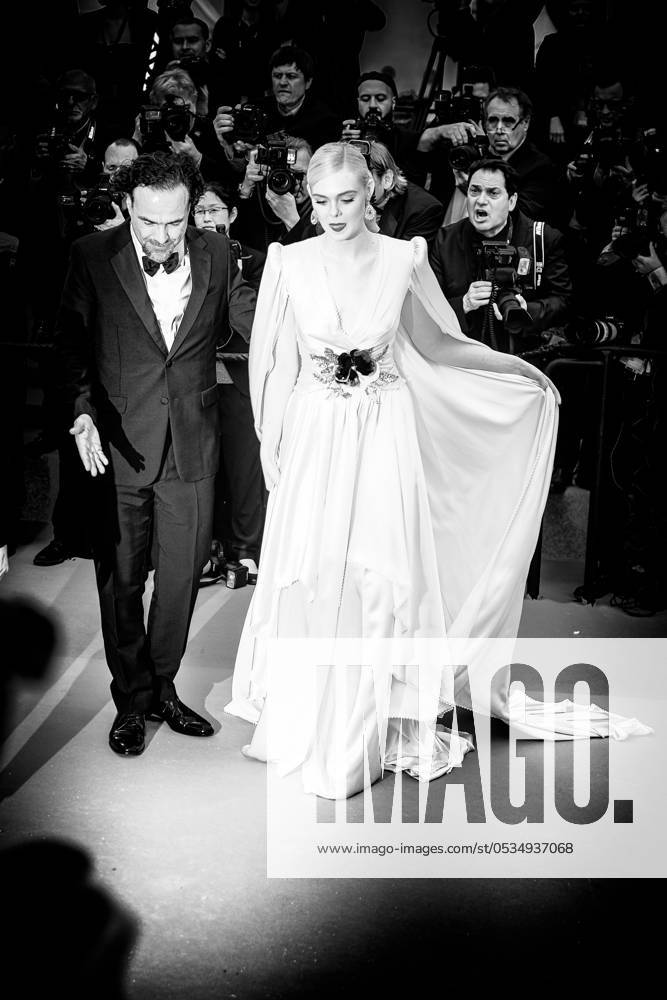 Alejandro Gonzalez Inarritu and Elle Fanning poses on the red carpet for the opening night film, The Dead Don t Die on Tuesday 14 May 2019 at the 72nd Festival de Cannes Alejandro Gonzalez Inarritu and Elle Fanning poses on the red carpet for the opening night film, The Dead Dont Die on Tuesday 14 May 2019 at the 72nd Festival de Cannes, Palais des Festivals, Cannes. Pictured: Elle Fanning, Alejandro Gonzalez Inarritu. Editors Note: This image as been converted to monochrome. LFI Avalon. All usages must be credited Julie Edwards LFI Avalon. Picture by Julie Edwards LFI Avalon. All usages must be credited Julie Edwards LFI Avalon.,