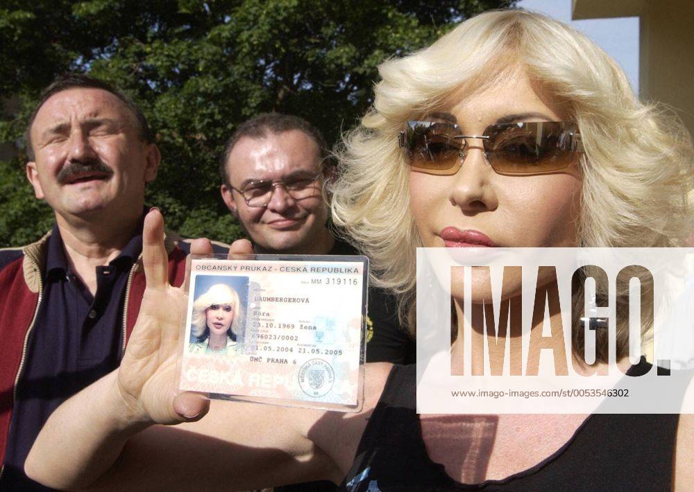 Nora Baumberger, former Czech-born German porn movie star Dolly Buster, who runs for the European Parliament as the leader of Czech party Independent Iniciative (NEI), shows her Czech identity card to journalists in front of a polling station after she was not allowed to cast her vote in the European Parliament balloting in Prague on Friday 11 June 2004. Baumberg was not on a list of eligible voters list as she had allegedly asked too late for the Czech identity card. - CTK Sterba Martin