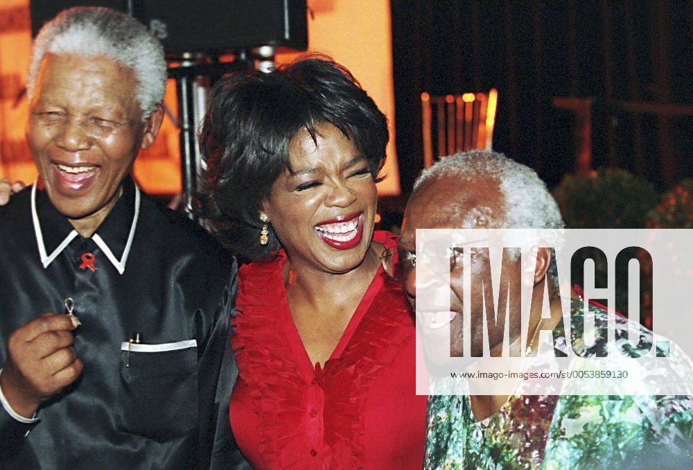 Former South African president Nelson Mandela (L), American talkshow host Oprah Winfrey and Archbishop Desmond Tutu share a joke at the Kirstenbosch Botanical Gardens in Cape Town, where the Nelson Mandela SOS to the world project is being launched. Gallo000033500