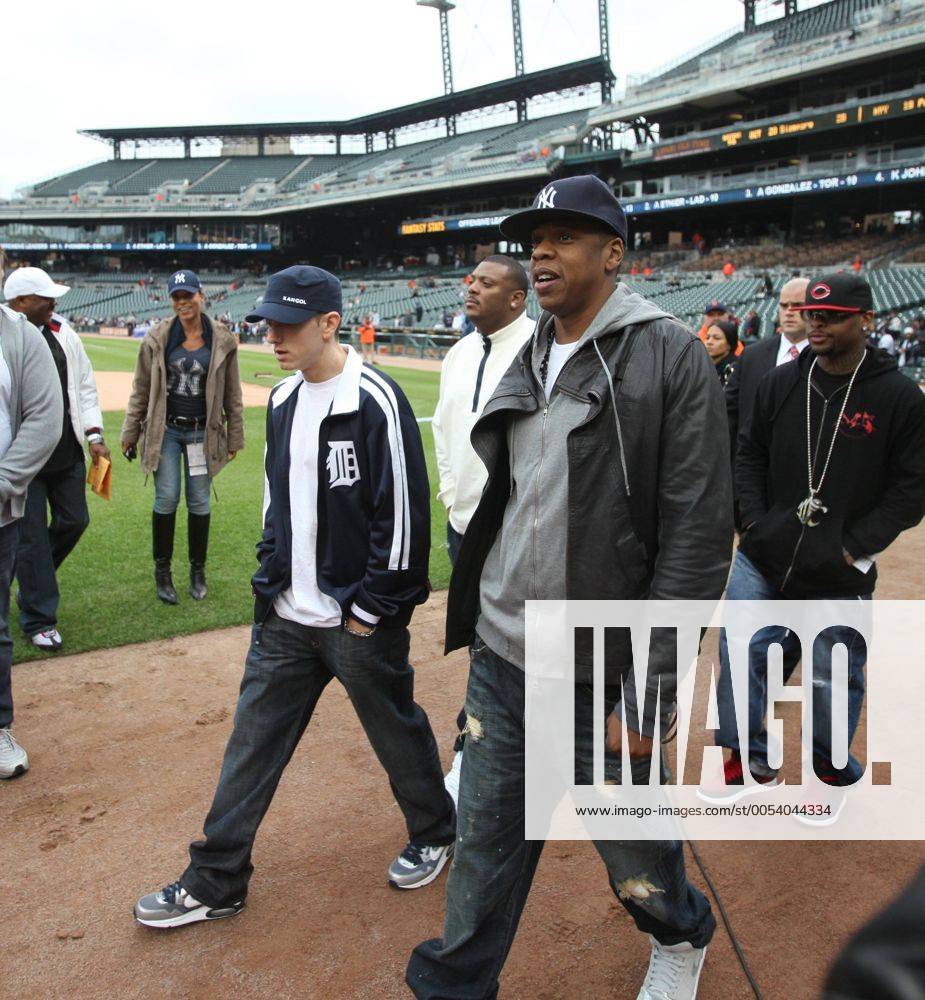 Detroit, Michigan, U.S. - Eminem (L) and Jay-Z walk onto the field to meet some of the Detroit Tigers at the dugout steps before the Tigers second game of their double header against the New York Yankees in Detroit MI on Wednesday, May 12, 2010. - ZUMAf31