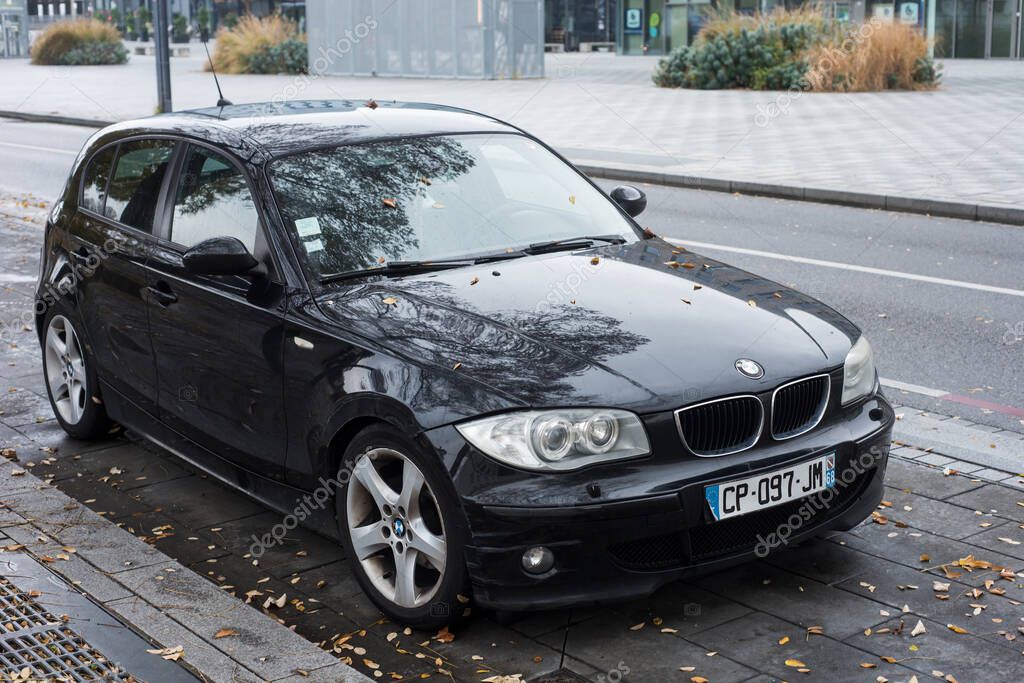 Mulhouse - France - 29 November 2020 - Front view of black bmw 120d parked in the street