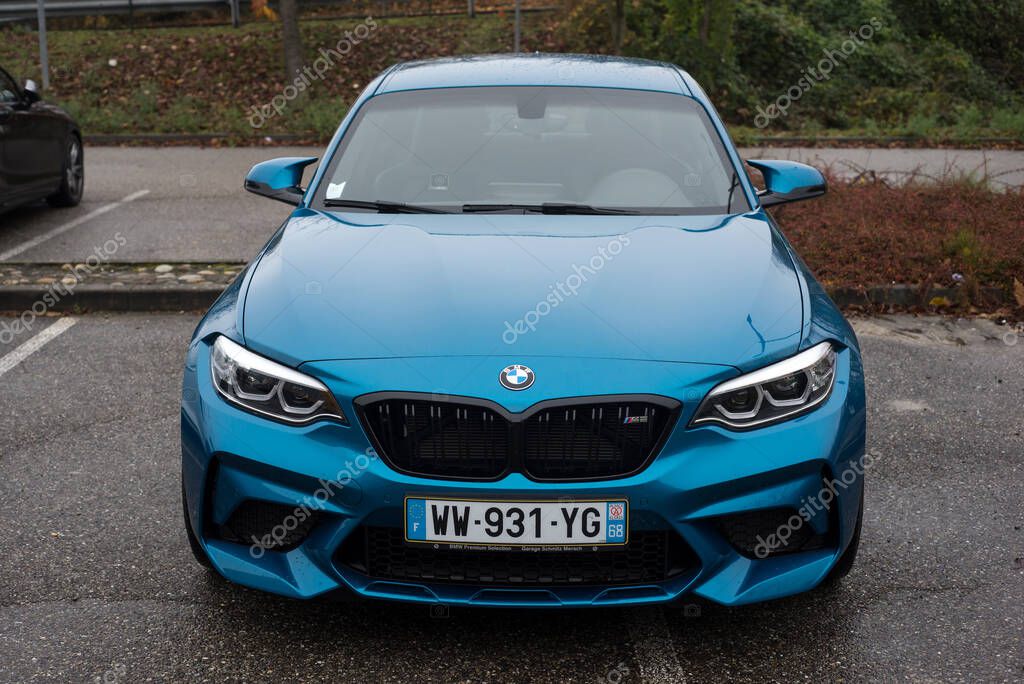 Mulhouse - France - 14 November 2021 - Front view of blue BMW M2 parked in the street