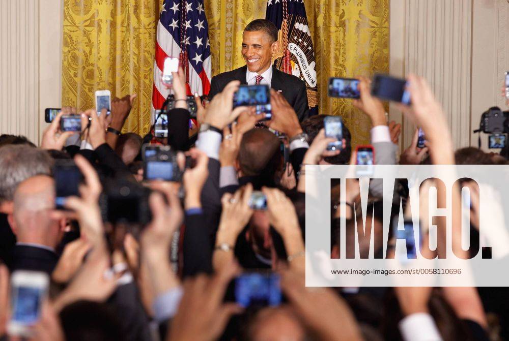 A sea of cell phones snap pictures as U.S. President Barack Obama hosts a reception in honor of national Gay, Lesbian, Bisexual and Transgender Pride Month in the East Room of the White House June 15, 2012 in Washington, DC. In the midst of a re-election campaign against former Massachusetts Gov. Mitt Romney, Obama s recent declaration of support for same-sex marriage was celebrated as a key endorsement among gay rights groups. WAX20120615206