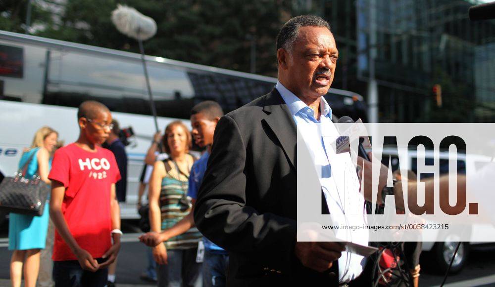 Rev. Jesse Jackson (C) is interviewed on video by a newsman near the Carolinafest during the 2012 Democratic National Convention in Charlotte, North Carolina on September 3, 2012. DNC2012090329