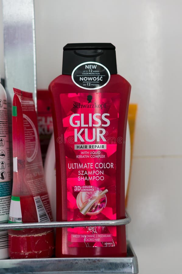 Gliss Kur shampoo, Gliss Kur Hair Repair Ultimate Color shampoo in a plastic bottle on a small shower shelf on August 2017 in Poznan, Poland