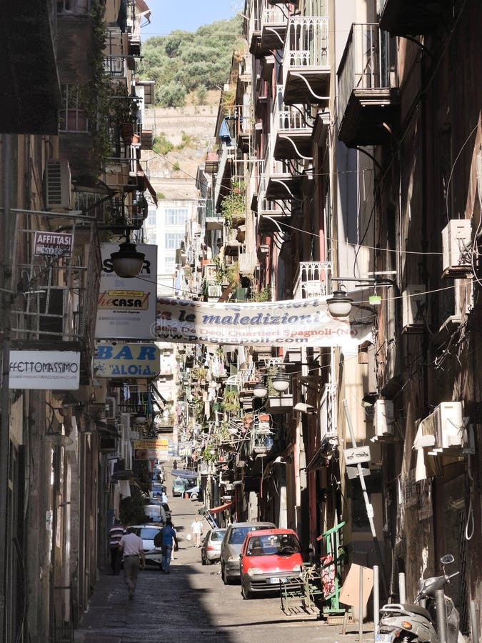 Street in old city of Naples, Italy, NAPLES, ITALY - AUGUST 11, 2013: Via De Deo Emanuele - street in old city of Naples, Italy. Historic Centre of Naples is UNESCO declared a Cultural Heritage site.