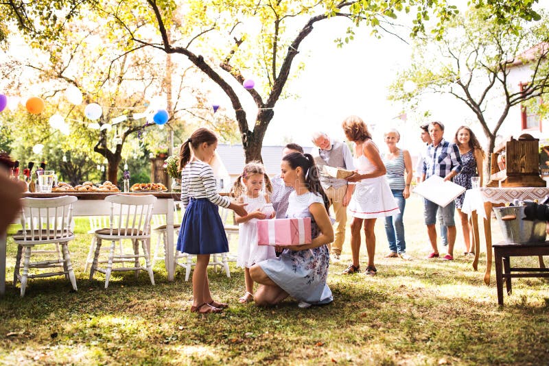 Family celebration or a garden party outside in the backyard., Family celebration outside in the backyard.Big garden party. Birthday party.