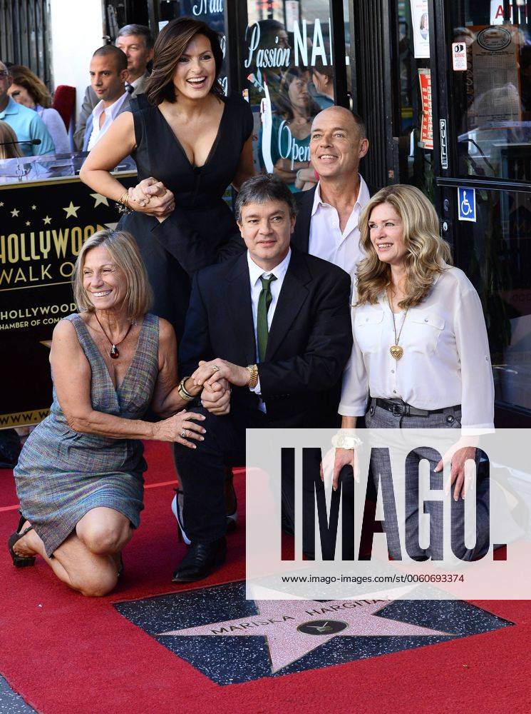 Actress Mariska Hargitay and her siblings Jayne Marie Mansfield, Mickey Hargitay, Zolton Hargitay and Tina West (L-R) gather around her star during an unveiling ceremony honoring Mariska Hargitay with the 2,511th star on the Hollywood Walk of Fame in Los Angeles on November 8, 2013. LAP2013110815