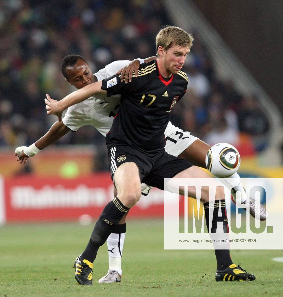 Andre Ayew from Ghana and Per Mertesacker from Germany during the 2010 World Cup soccer game between Ghana (white) and Germany (black) on June 23, 2010 at Soccer City in Johannesburg Gallo0000117611 Dede