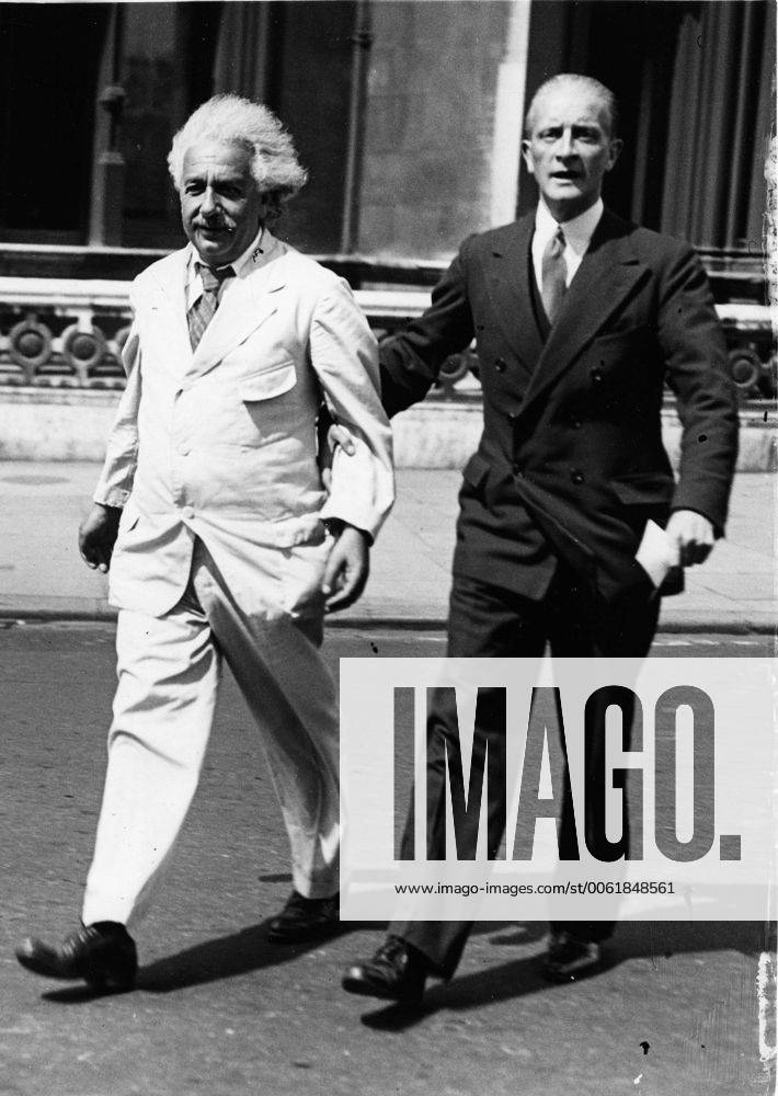 London, England, U.K. - Professor ALBERT EINSTEIN walking with Commander LOCKER LAMPSON. Einstein (March 14, 1879 Ð April 18, 1955) was a German theoretical physicist regarded as the greatest scientist of the 20th century. He proposed the theory of relativity and made contributions to the development of quantum mechanics, statistical mechanics, and cosmology. London United Kingdom - ZUMAk09